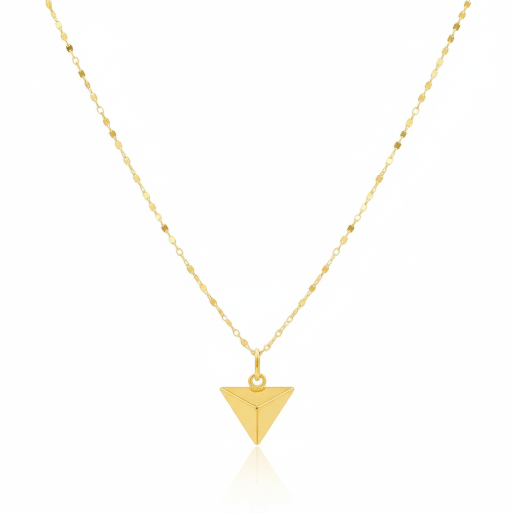 Gold triangle pendant necklace on a white background
