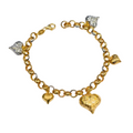 Gold bracelet with heart-shaped charms on a white background