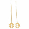Gold earrings with circular designs on a white background