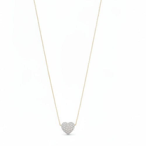 Necklace with a heart-shaped pearl pendant on a mannequin bust against a white background