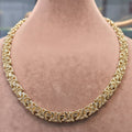 Gold chain necklace on a person's neck with measurements displayed.