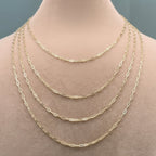 Gold chain necklace on a mannequin with measurements displayed.