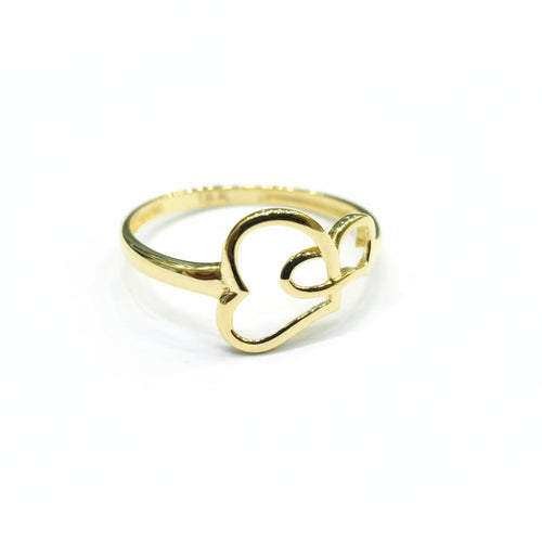 Gold ring with heart design on a gray background