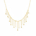 Delicate gold necklace on a mannequin with weight and code information.