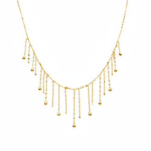 Delicate gold necklace on a mannequin with weight and code information.