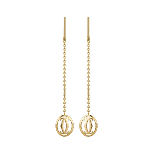 Gold earrings with chain designs on a white background