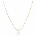 Necklace with a white ribbon pendant on a gold chain against a white background