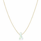 Necklace with a white ribbon pendant on a gold chain against a white background