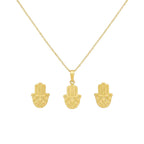Gold hamsa hand necklace and earrings on a white background